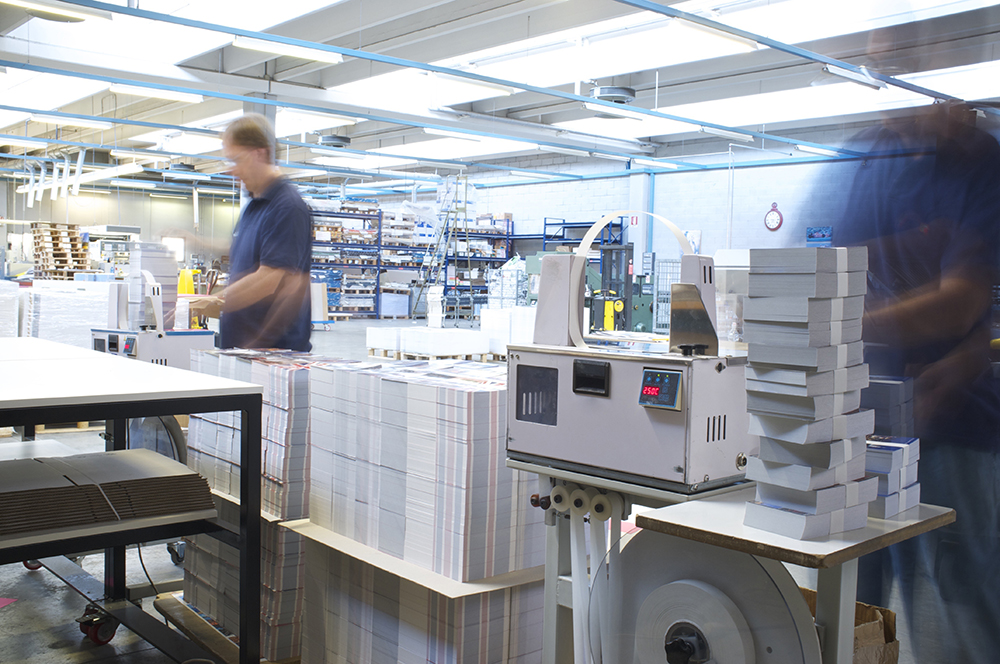 man-stacking-printing